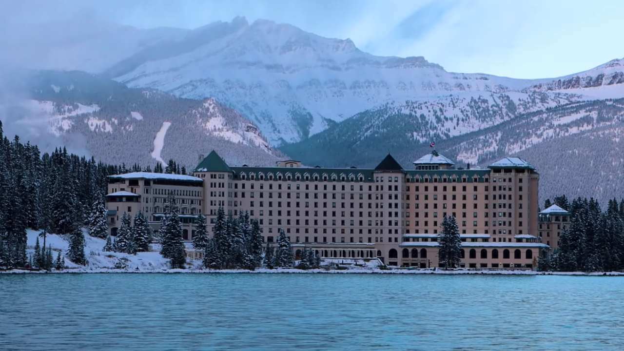 fairmont chateau lake louise looking back from trail along the lake.