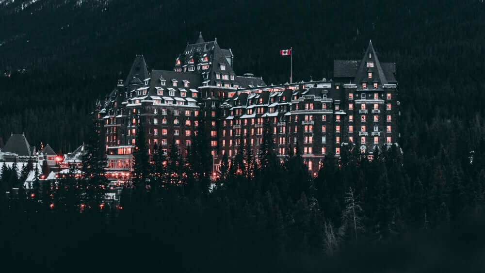 fairmont banff springs in evening hotel resort. from across bow river