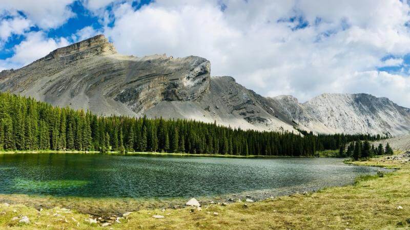 picklejar lakes trail kananaskis hiking looking at lake with mountain in background
