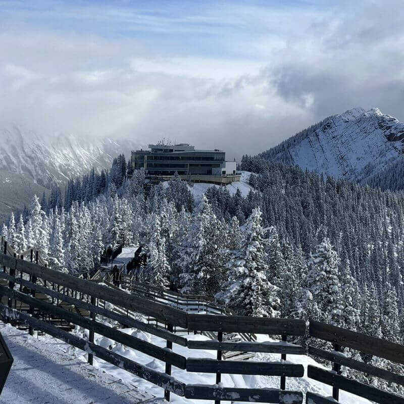 best attraction main banner image banff gondola with snowy peaked mountain looking at Sky Bistro and mountains in background 1x1 800