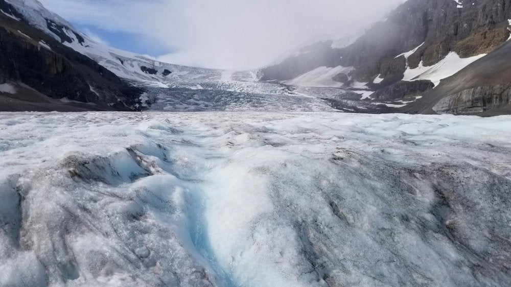 cool ice colors pic from laying right down on ice looking up the glacier