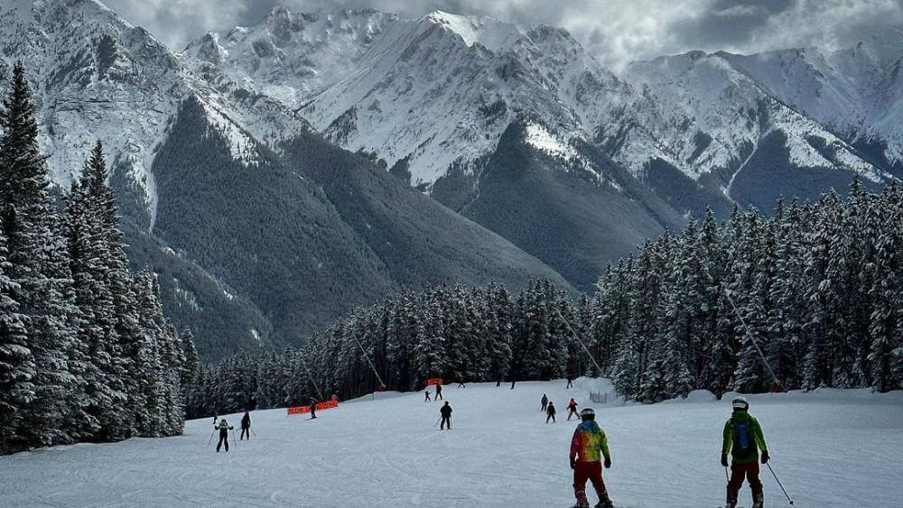 nakiska ski resort with mountain backdrop looking godly
