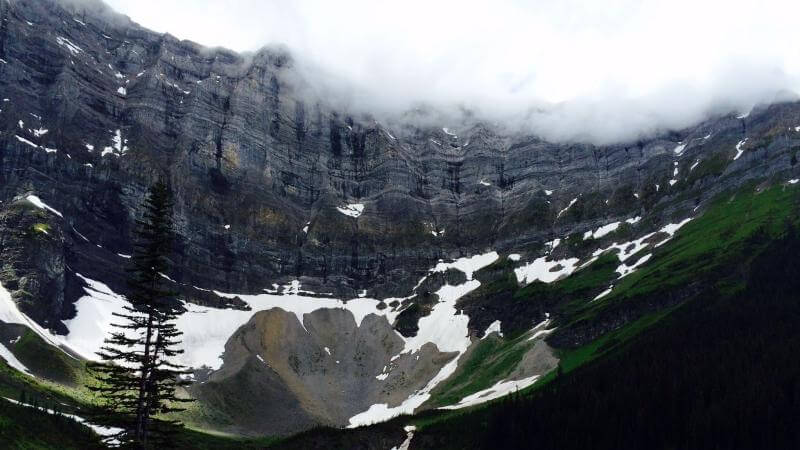 sarrail ridge via rawson lake trail center of the mountain bowl on lake.  