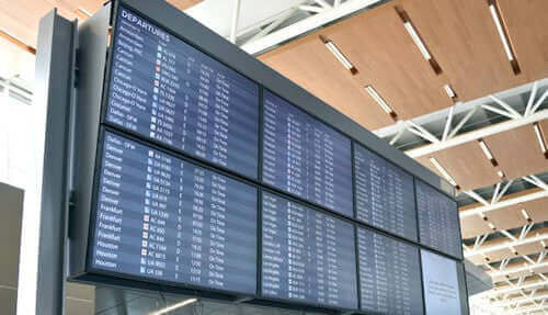 modern electronic status flight boards throughout calgary airport